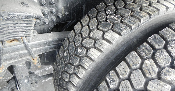 Check tire life left by measuring depth of tires with a tire gauge