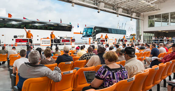 Bidding begins on a lineup of buses 