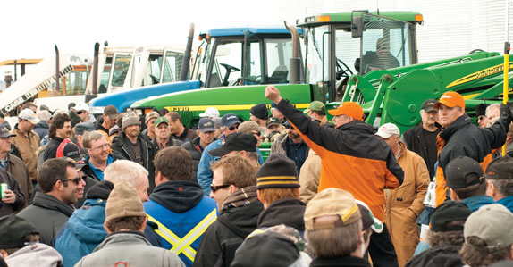 Farm tractors being sold at a Ritchie Bros. auction