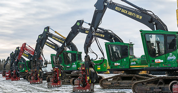 A line-up of John Deere dangle head processor’s at Ritchie Bros. Prince George auction.