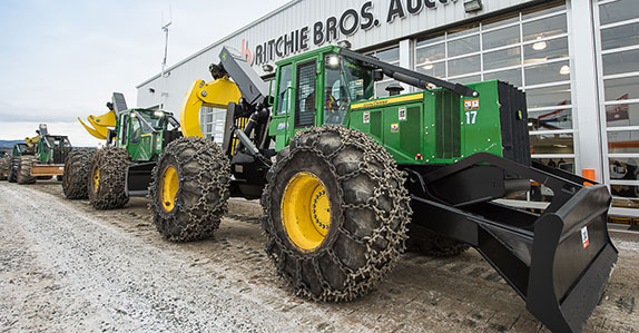 Some John Deere grapple skidders being sold at Ritchie Bros. Prince George