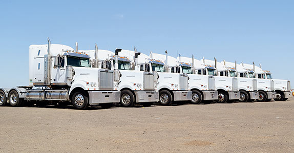 A line-up of 2013 Western Star 4900FX and 4900FXT in Geelong.