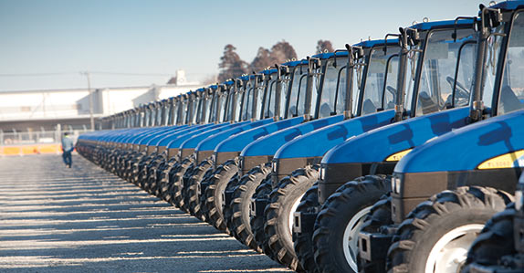 Farm tractors lined up at a Ritchie Bros. auction