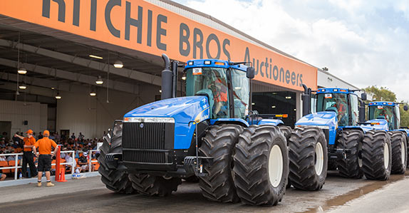 Farm tractors being sold at a Ritchie Bros. auction in Australia